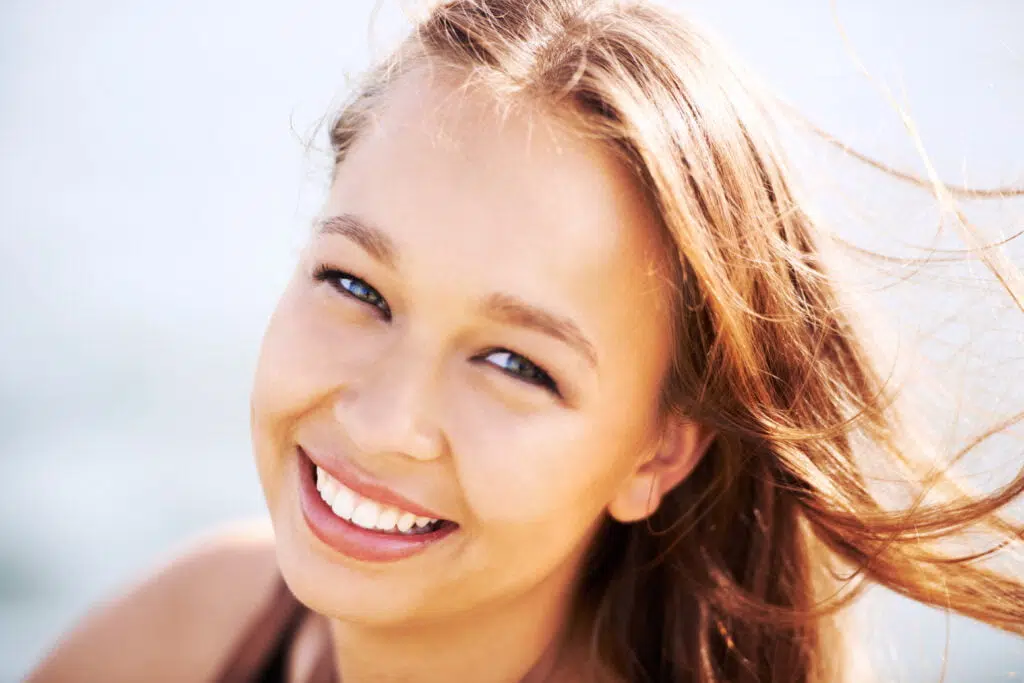 young teen smiling with white teeth