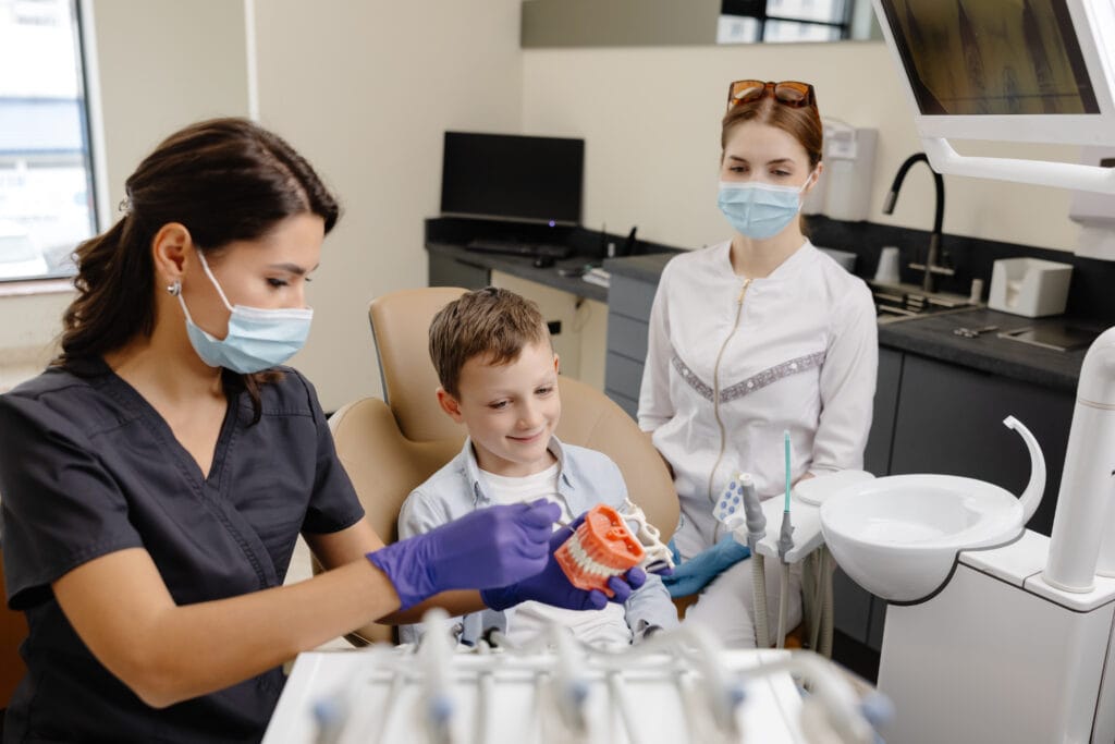 dental care for children nurse talking to little boy